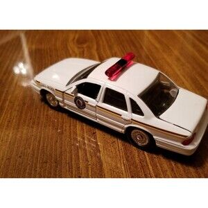 North Dakota State Patrol Road Champs die cast police car 1:43 scale